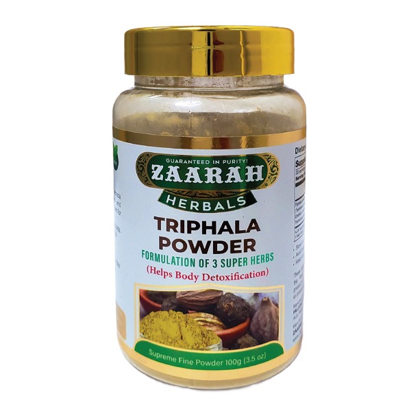 A small pile of Triphala powder, a traditional herbal remedy, in a wooden spoon against a white background.